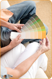 Couple looking at paint swatches.